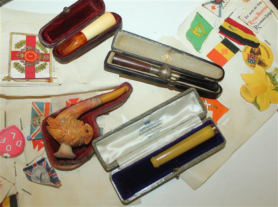 Collection of cigarette holders, pipe & W.War flag pins